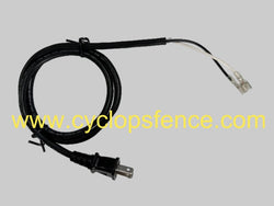 Black replacement ac powered electric cable for a cyclops fence charger on grey background