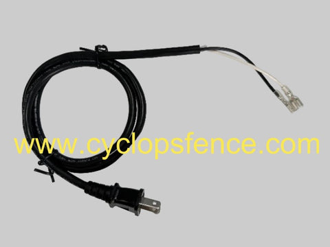 Black replacement ac powered electric cable for a cyclops fence charger on grey background