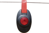 Patriot fence alert Black and red light hanging on a wire against a white background
