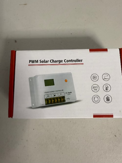 Box with a PWM Solar Charge Controller for electric fence charger systems on a plain background
