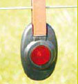 Speedrite Fence Alert hanging on fence wire
